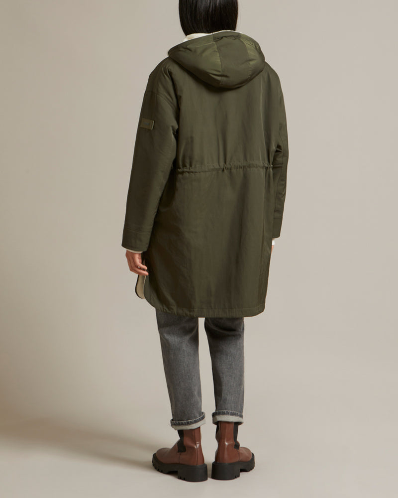 Parka réversible en tissu technique déperlant et peau lainée mérinillo