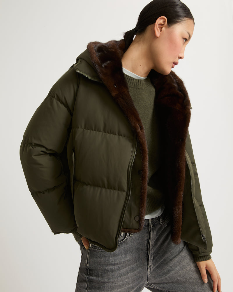 A line down jacket in technical fabric with long-haired mink hooded bib