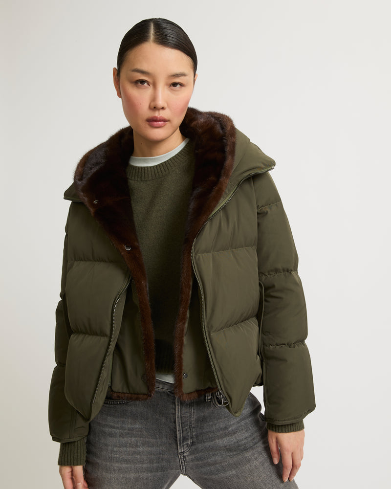 A line down jacket in technical fabric with long-haired mink hooded bib