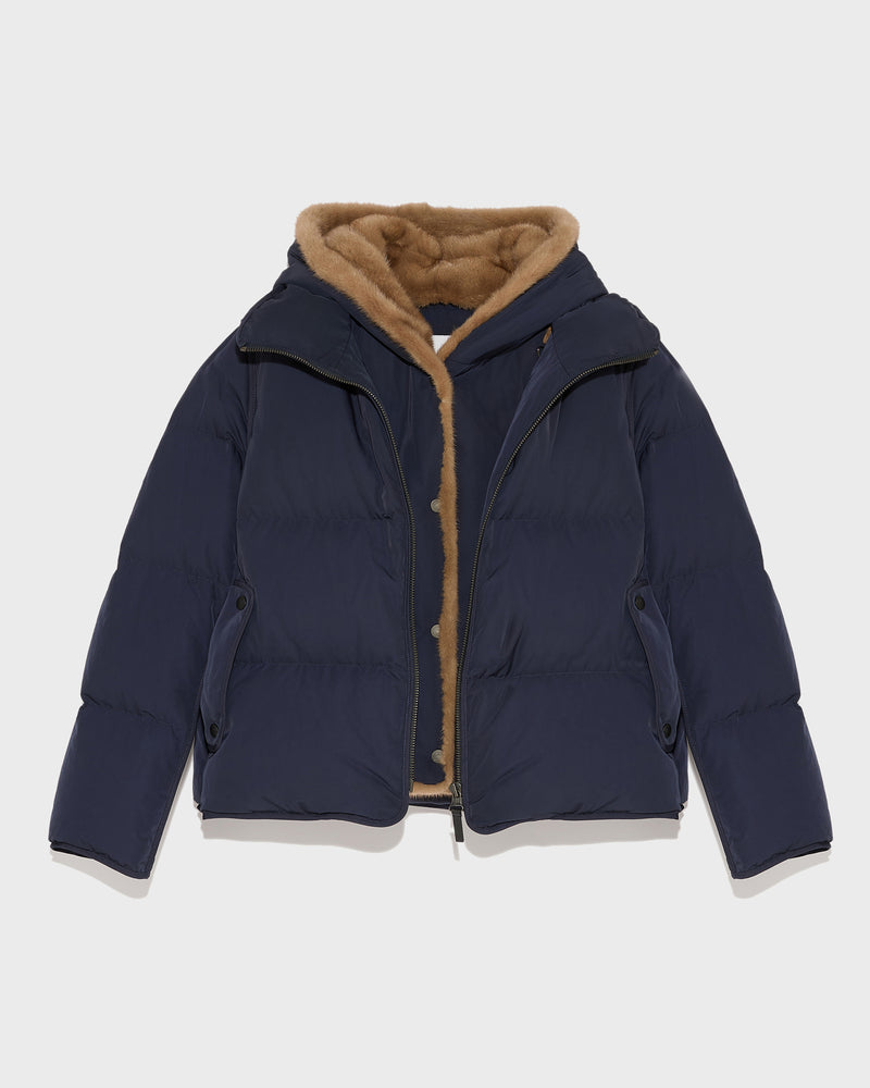 A line down jacket in technical fabric with long-haired mink hooded bib