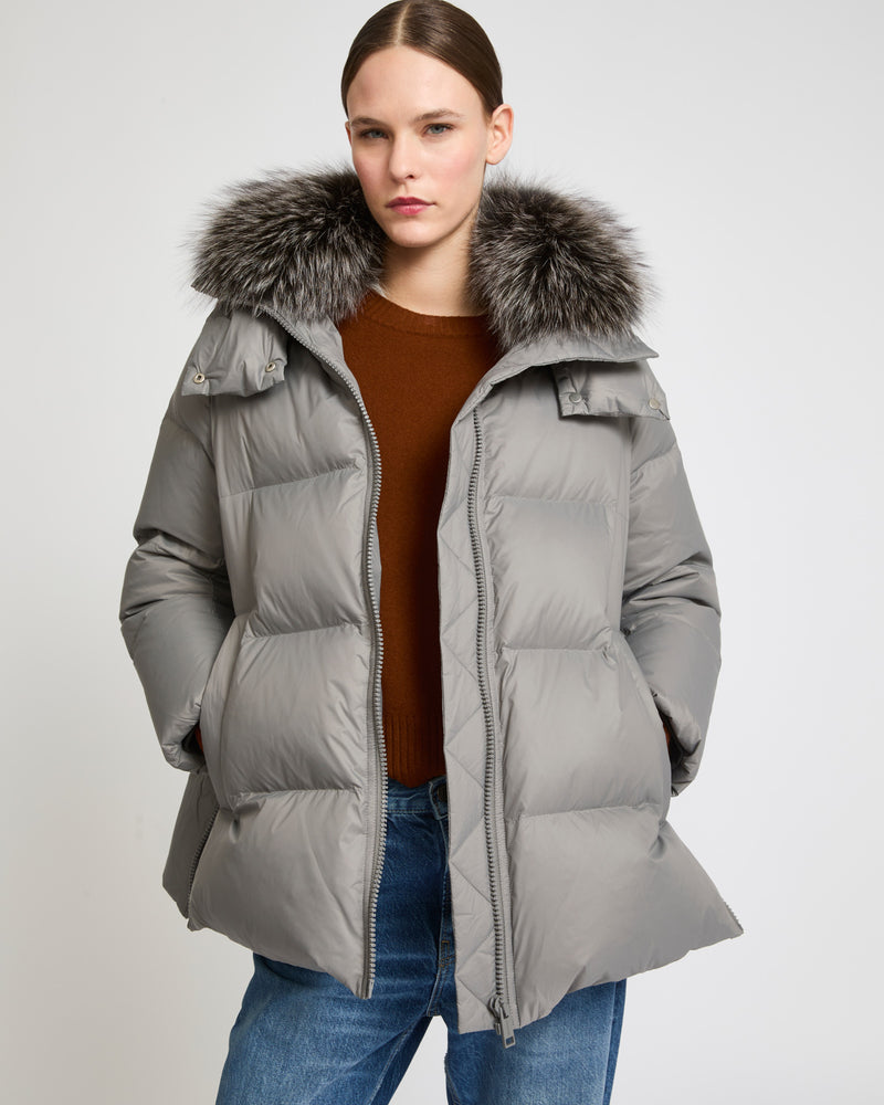 A line down jacket in water-repellent technical fabric with fox fur collar