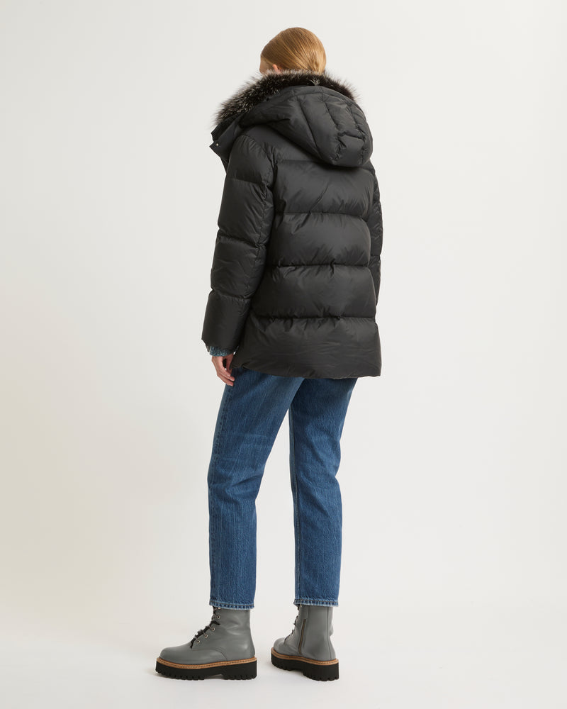 A line down jacket in water-repellent technical fabric with fox fur collar