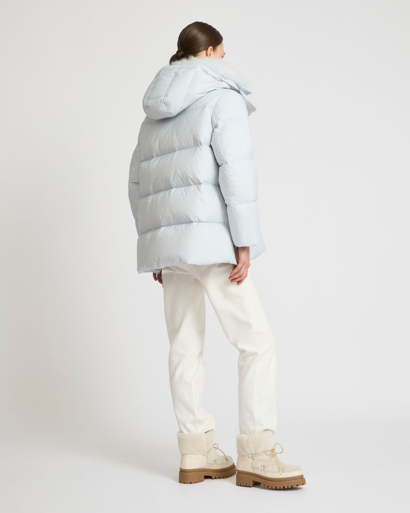 A line down jacket in water-repellent technical fabric with fluffy lambswool collar