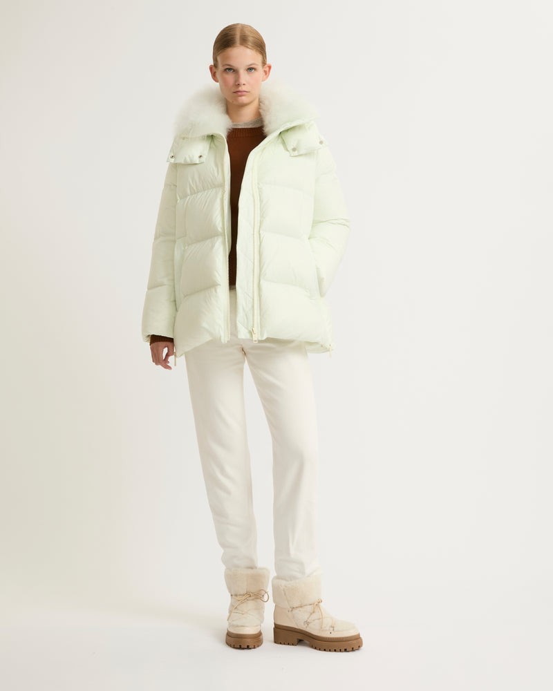 A line down jacket in water-repellent technical fabric with fluffy lambswool collar