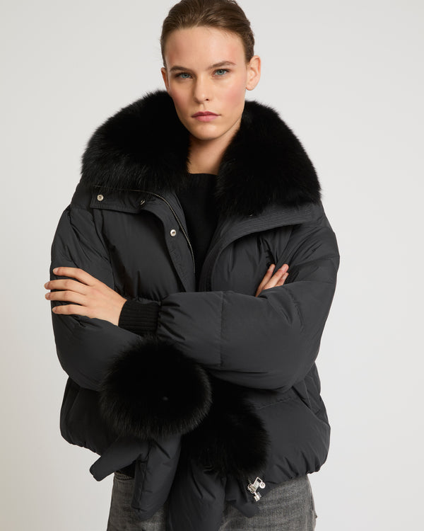 Boxy down jacket in waterproof technical fabric with fox fur collar