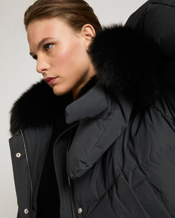 Boxy down jacket in waterproof technical fabric with fox fur collar