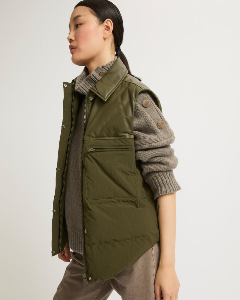 Down gilet in leather and technical fabric blend