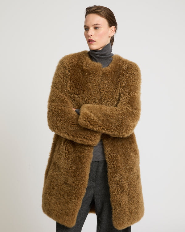 Coat in merino knit and lambskin