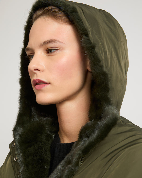 Hooded down jacket in technical fabric and mink fur