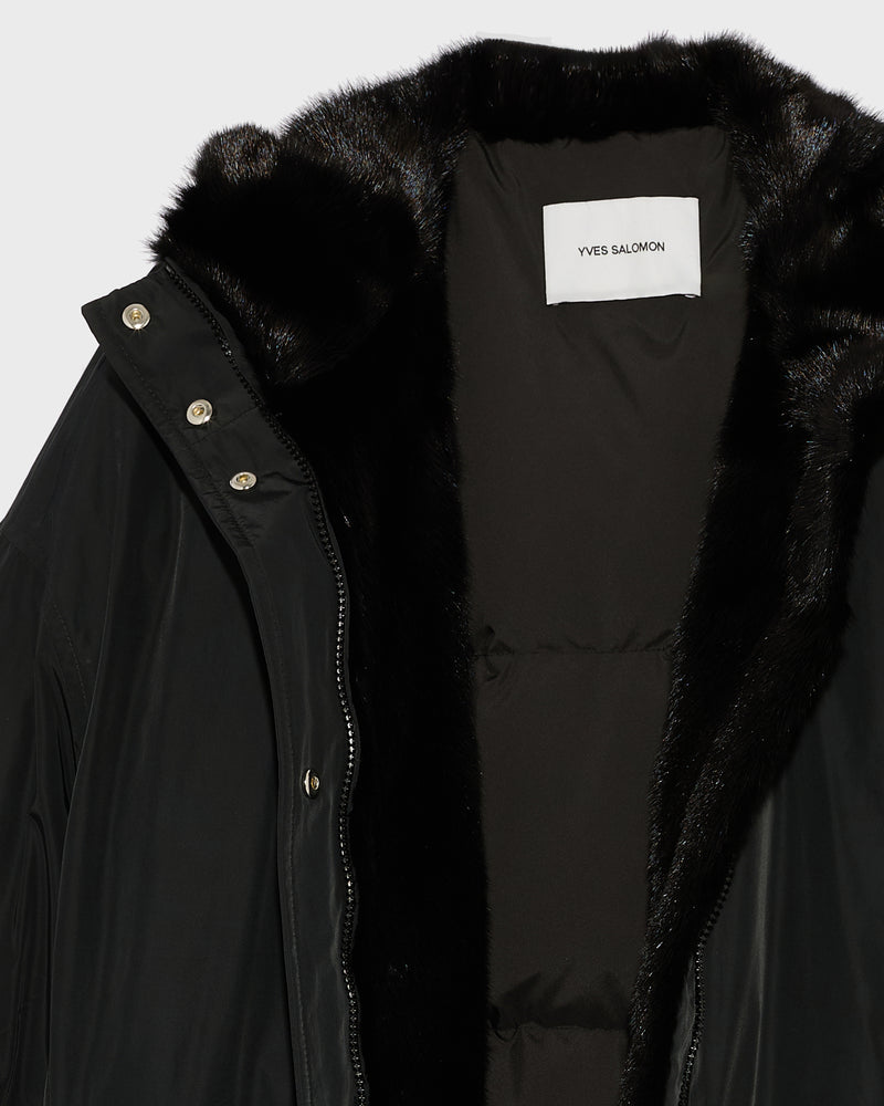 Hooded down jacket in technical fabric and mink fur