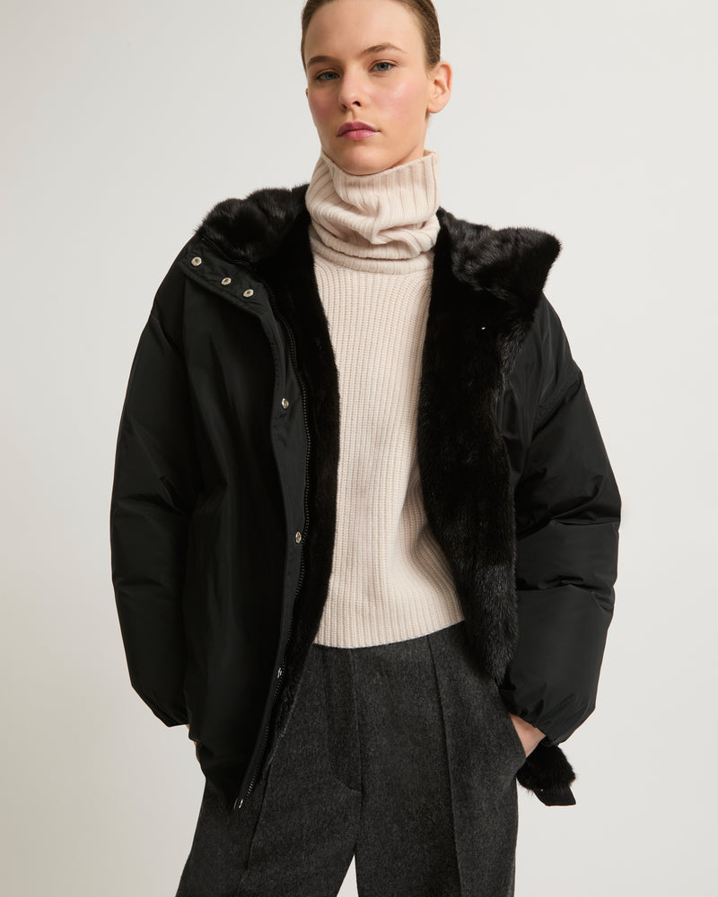 Hooded down jacket in technical fabric and mink fur