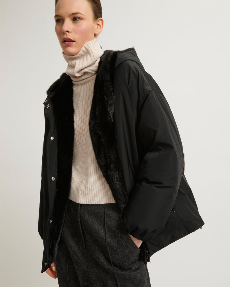 Hooded down jacket in technical fabric and mink fur