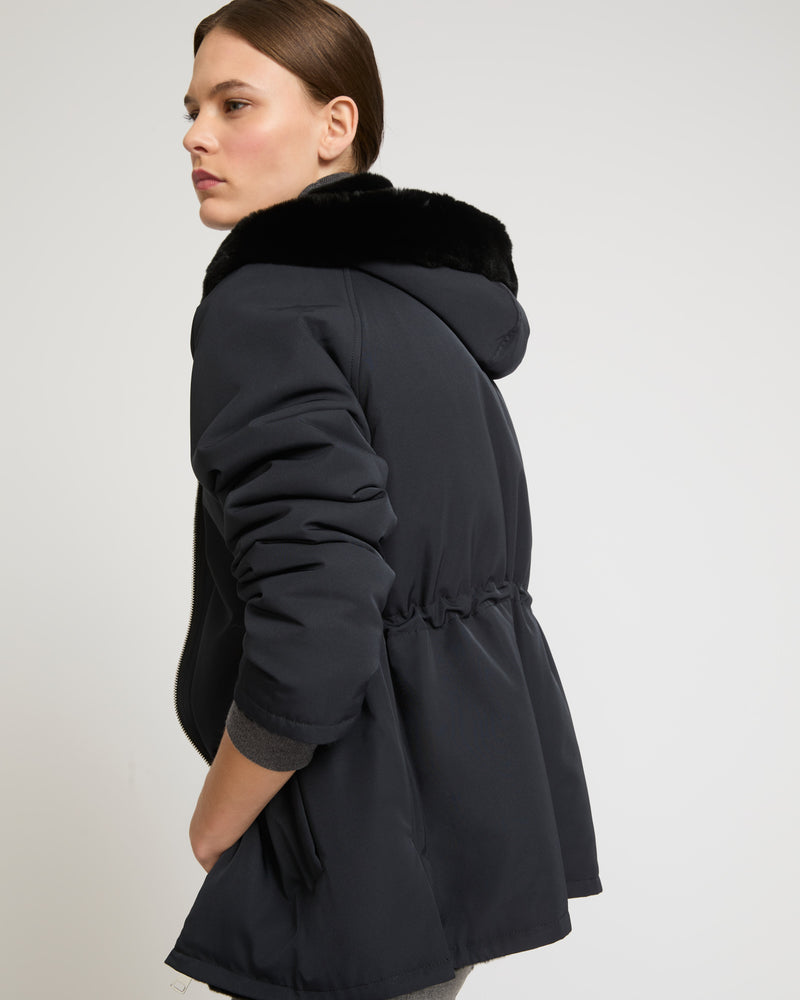 Reversible hooded jacket in rex fur and technical fabric